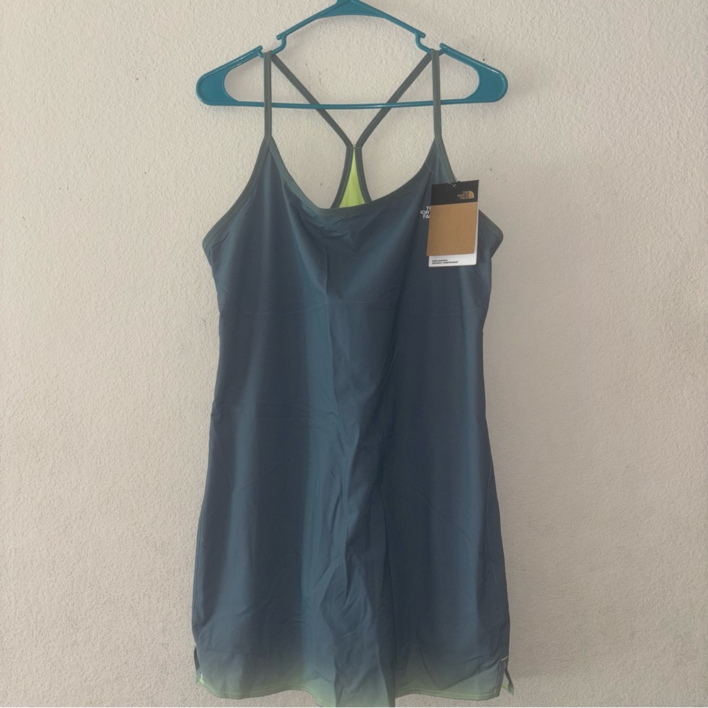 The North Face Teal Tank with neon lime interior, size Large